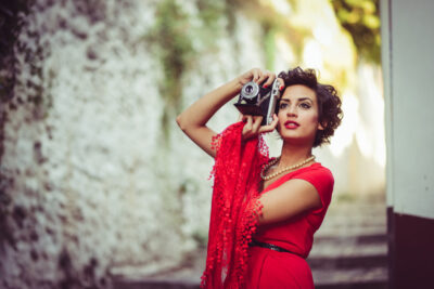 stylish-woman-with-retro-camera